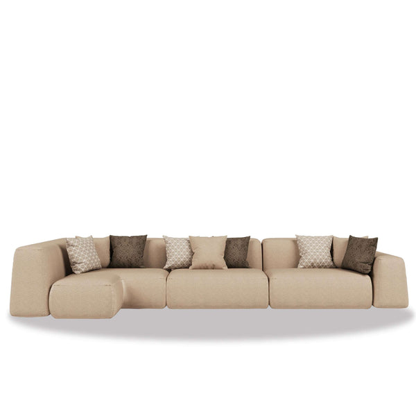Al Sarab Majlis modular seating in warm neutral tones with layered cushions and a low continuous profile