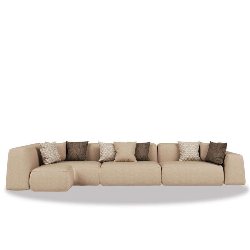 Al Sarab Majlis modular seating in warm neutral tones with layered cushions and a low continuous profile