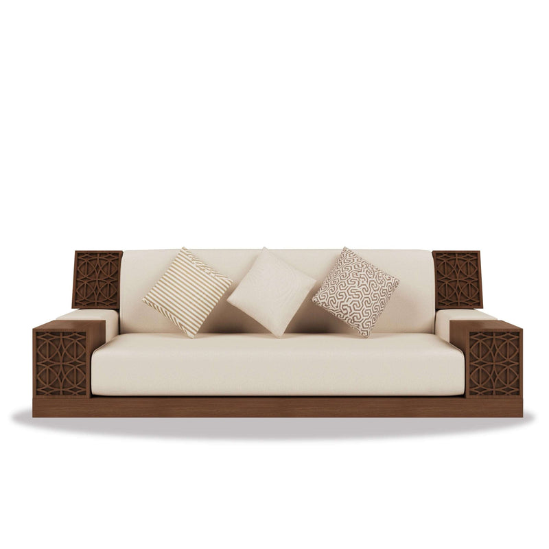 Al Naqsh Majlis with detailed CNC-cut geometric wood patterns and soft upholstery in warm tones and gold accents