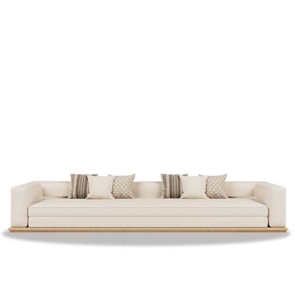 Minimalist Al Diwan Majlis seating area with warm wood accents and soft neutral tones promoting balance and dialogue