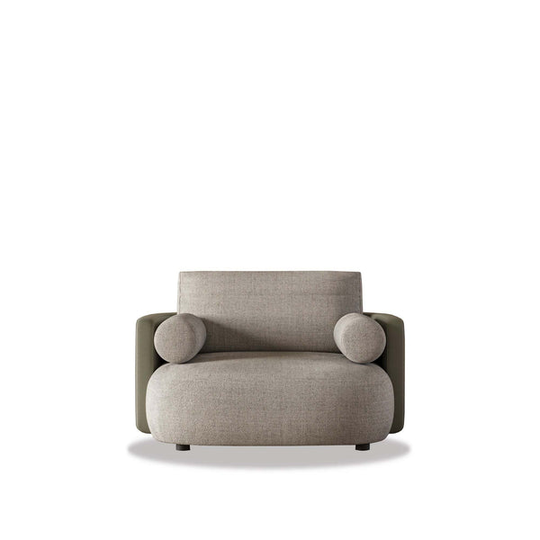 Thalia Lounge Armchair modern low-slung design with cylindrical bolster cushions and padded core