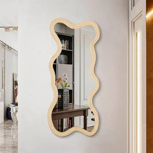 Drake Mirror with wavy natural wood frame in modern interior setting